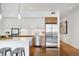Bright kitchen with stainless steel appliances, white countertops, and modern cabinetry at 2640 Central Ct # 204, Denver, CO 80211