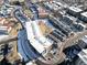 Overhead view of an apartment complex with parking, a large roof, and landscaping at 2876 W 53Rd Ave # 122, Denver, CO 80221
