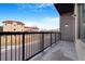 Apartment balcony with black metal railing overlooking the street at 2876 W 53Rd Ave # 122, Denver, CO 80221