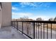 Apartment balcony with black metal railing overlooking the parking lot at 2876 W 53Rd Ave # 122, Denver, CO 80221