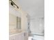 Bathroom with neutral colored vanity, shower, and bathtub at 2876 W 53Rd Ave # 122, Denver, CO 80221