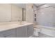 Modern bathroom features sleek vanity with a tiled shower and tub combination at 2876 W 53Rd Ave # 122, Denver, CO 80221
