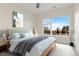 Bright bedroom with large windows and a serene color palette at 2876 W 53Rd Ave # 122, Denver, CO 80221