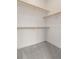 Bright white walk-in closet with carpet flooring and wooden storage racks at 2876 W 53Rd Ave # 122, Denver, CO 80221