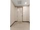 Neutral interior door to the room featuring carpeted floors and clean walls at 2876 W 53Rd Ave # 122, Denver, CO 80221
