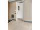 A hallway entrance door with modern design elements, including stone accents and decorative pebbles at 2876 W 53Rd Ave # 122, Denver, CO 80221