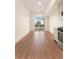 Open living area featuring hardwood floors and a sliding glass door to a balcony at 2876 W 53Rd Ave # 122, Denver, CO 80221