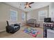 Bedroom featuring a crib, lounge chair, and lots of natural light at 14997 Elsinore Ave, Parker, CO 80134