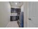 Laundry room features washer, dryer and ample storage above a countertop at 14997 Elsinore Ave, Parker, CO 80134