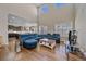 Bright and airy living room with soaring ceilings, hardwood floors, and a comfortable sectional at 14997 Elsinore Ave, Parker, CO 80134