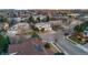 Aerial view of a home in a quiet suburb neighborhood with mature trees and well-maintained streets at 683 Ridgemont Cir, Highlands Ranch, CO 80126