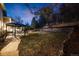 Beautiful backyard with stone patio, gazebo, and tiered landscaping creating a private oasis at 683 Ridgemont Cir, Highlands Ranch, CO 80126