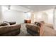 Finished basement featuring plush carpeting and comfortable seating, ideal for relaxation or entertainment at 683 Ridgemont Cir, Highlands Ranch, CO 80126
