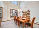 Dining room with high ceilings, hardwood floors, large window, and stylish chandelier at 683 Ridgemont Cir, Highlands Ranch, CO 80126