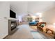 Spacious main bedroom suite with a fireplace, large windows, and a comfortable seating area at 683 Ridgemont Cir, Highlands Ranch, CO 80126