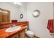 Tastefully decorated powder room with a stylish mirror, attractive tile accents, and modern fixtures at 683 Ridgemont Cir, Highlands Ranch, CO 80126