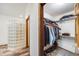 Walk-in closet with ample clothing racks conveniently located next to the Primary bathroom at 683 Ridgemont Cir, Highlands Ranch, CO 80126