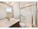 Modern bathroom featuring tile surround shower, white vanity, and hardwood style floors at 5926 Hickory Oaks Trl, Castle Rock, CO 80104