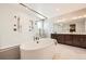 Gorgeous bathroom featuring a soaking tub, and glass-enclosed shower with double vanity at 5926 Hickory Oaks Trl, Castle Rock, CO 80104