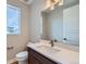 Bathroom featuring a vanity with a white countertop, modern fixtures, and ample lighting at 5926 Hickory Oaks Trl, Castle Rock, CO 80104