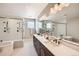 Beautiful bathroom with a double vanity, soaking tub, and glass enclosed shower with tile surround at 5926 Hickory Oaks Trl, Castle Rock, CO 80104