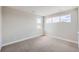 Bedroom featuring carpeted floors, neutral paint color, and natural light from windows at 5926 Hickory Oaks Trl, Castle Rock, CO 80104
