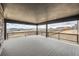 Covered outdoor deck featuring a wood railing with neighborhood views at 5926 Hickory Oaks Trl, Castle Rock, CO 80104