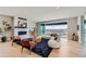 Stylish living room with fireplace, hardwood floors, and large windows overlooking a scenic view at 5926 Hickory Oaks Trl, Castle Rock, CO 80104