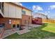 Backyard with a patio, deck, and well-maintained lawn is ideal for outdoor living and gatherings at 10622 Van Gordon Way, Broomfield, CO 80021