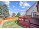 Inviting backyard features a charming wooden deck and well-maintained lawn, perfect for outdoor living at 10622 Van Gordon Way, Broomfield, CO 80021