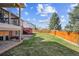 Spacious backyard featuring lush green grass and wood fence offers space for outdoor activities and relaxation at 10622 Van Gordon Way, Broomfield, CO 80021