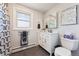 A well-lit bathroom features a vanity, medicine cabinet, and stylish decor for convenience at 10622 Van Gordon Way, Broomfield, CO 80021