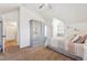 Cozy bedroom with gray armoire, a sloped ceiling, and comfortable bed at 10622 Van Gordon Way, Broomfield, CO 80021