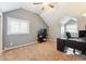 A bedroom features plush carpeting, a window, and a ceiling fan for comfortable living at 10622 Van Gordon Way, Broomfield, CO 80021