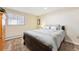 A comfortable bedroom features a plush bed, a window, and soft lighting for relaxation at 10622 Van Gordon Way, Broomfield, CO 80021