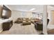 Cozy living area with comfortable seating and a large TV for relaxation and entertainment at 10622 Van Gordon Way, Broomfield, CO 80021