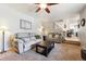 Open living space flows into the kitchen and features a staircase with metal railings at 10622 Van Gordon Way, Broomfield, CO 80021