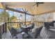 Covered patio with stylish seating and a grill, perfect for outdoor dining and entertaining at 10622 Van Gordon Way, Broomfield, CO 80021