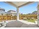 Inviting backyard patio with wooden fence, garden boxes, and view of neighboring houses at 9111 W 100Th Way, Broomfield, CO 80021