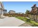 Landscaped backyard featuring a patio, lawn, and a wooden fence for privacy at 9111 W 100Th Way, Broomfield, CO 80021