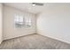 Bright bedroom with neutral carpet and a ceiling fan at 9111 W 100Th Way, Broomfield, CO 80021