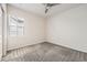 Clean bedroom with neutral carpet, ceiling fan and window at 9111 W 100Th Way, Broomfield, CO 80021