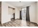 Cozy dining area with a stylish chandelier and convenient access to a wet bar and patio at 9111 W 100Th Way, Broomfield, CO 80021