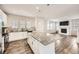 Open kitchen featuring granite counters, stainless steel appliances, and an island open to the living room at 9111 W 100Th Way, Broomfield, CO 80021