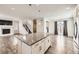 Open kitchen featuring granite counters, stainless steel appliances and an island open to the staircase at 9111 W 100Th Way, Broomfield, CO 80021