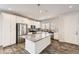 Modern kitchen featuring stainless steel appliances, an island, and granite countertops at 9111 W 100Th Way, Broomfield, CO 80021