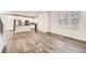 Open concept living and kitchen area with hardwood floors and plenty of natural light at 9111 W 100Th Way, Broomfield, CO 80021