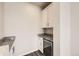 Walk in pantry features granite counters, white cabinets and wine fridge at 9111 W 100Th Way, Broomfield, CO 80021