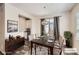 Cozy dining room featuring modern decor, hardwood floors, and a door to the backyard at 9111 W 100Th Way, Westminster, CO 80021
