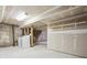 Unfinished basement, providing ample space and a utility area with laundry hookups at 18508 E Whitaker Cir # D, Aurora, CO 80015